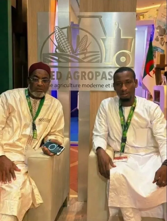 MED AGROPASCOM representatives in front of the company logo
